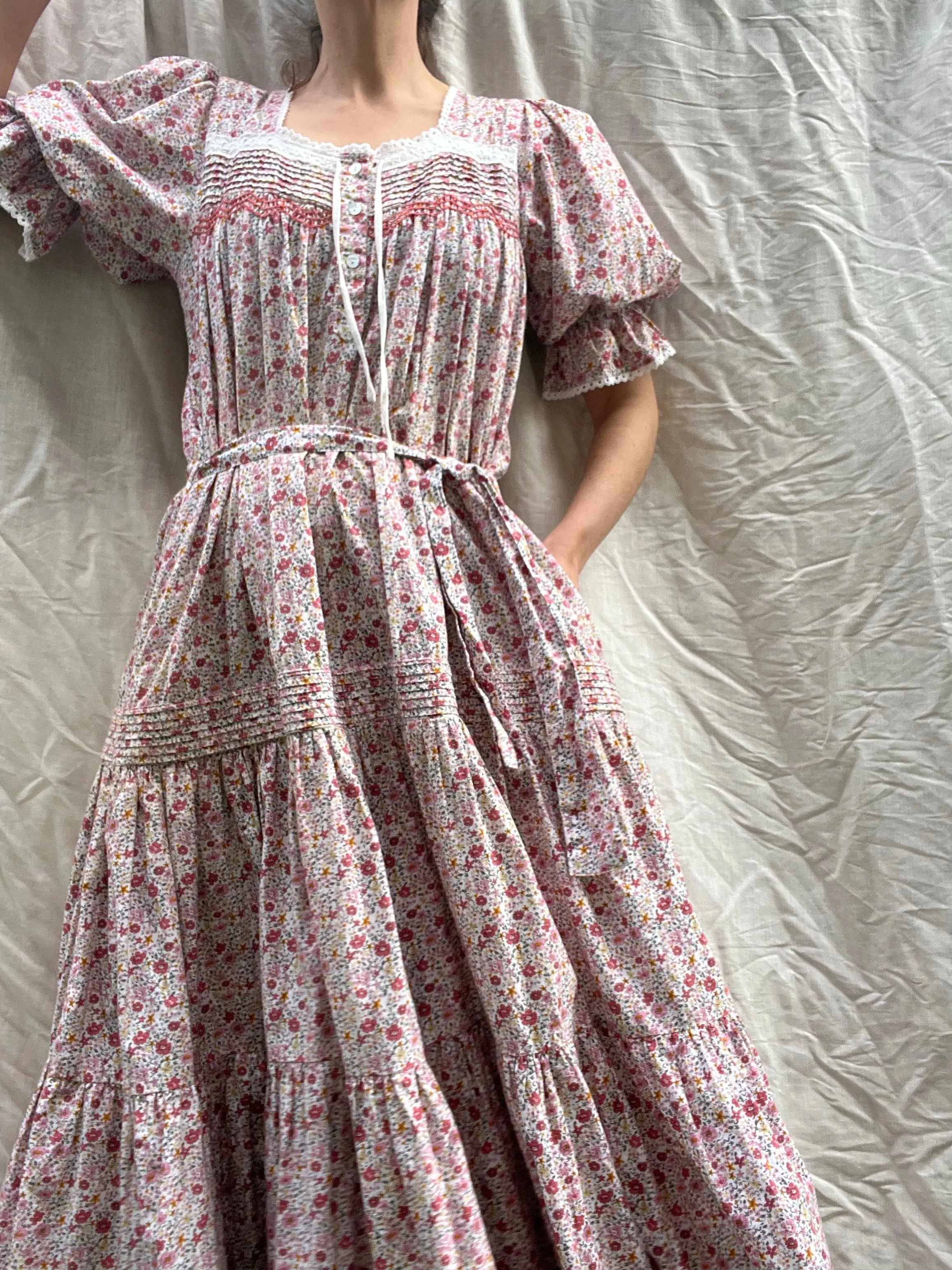 100% RECYCLED COTTON - MORNING SONG HAND SMOCKED TIERED DRESS - PINK DITSY FLORAL